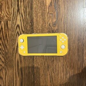 yellow nintendo switch lite with clear protective case